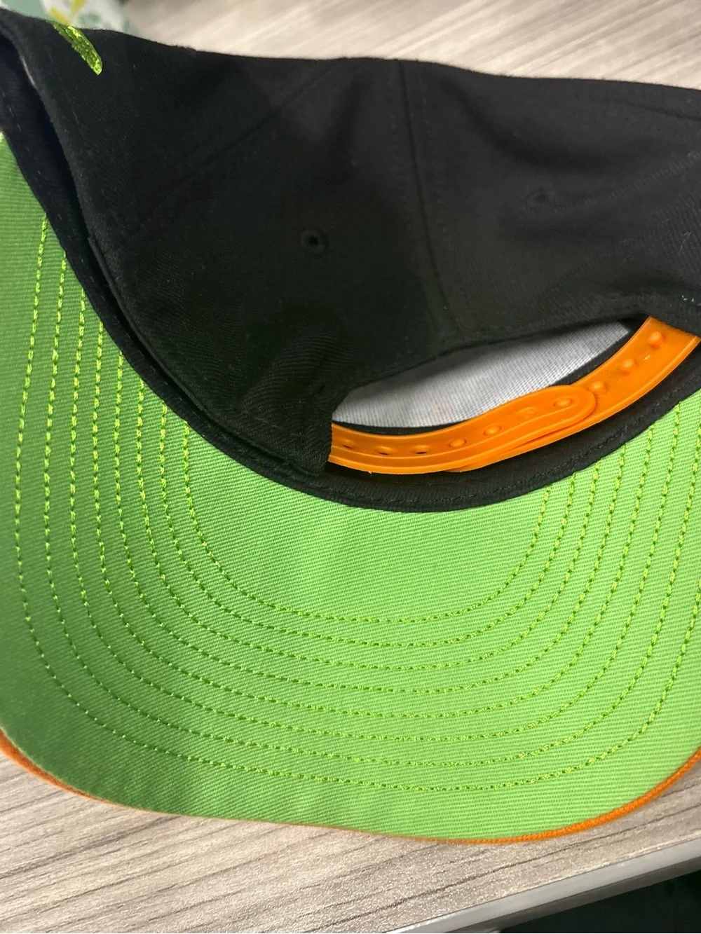 New Era Kids Orange and Black Baseball Cap with Green Embroidery